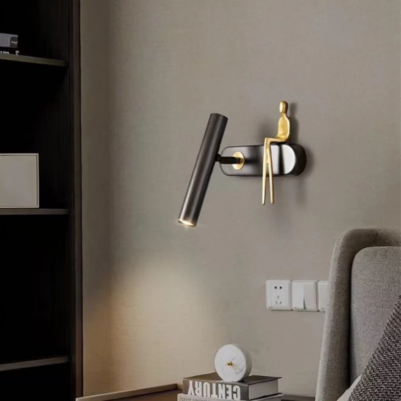 Minimalist Wall mounted Light with Seated human figure, Gold/Black