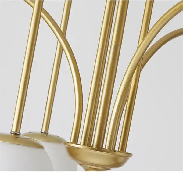 Close-up of the Modern Magic Beans 4-Head Gold LED Chandelier showing gold finish and frosted glass globes.