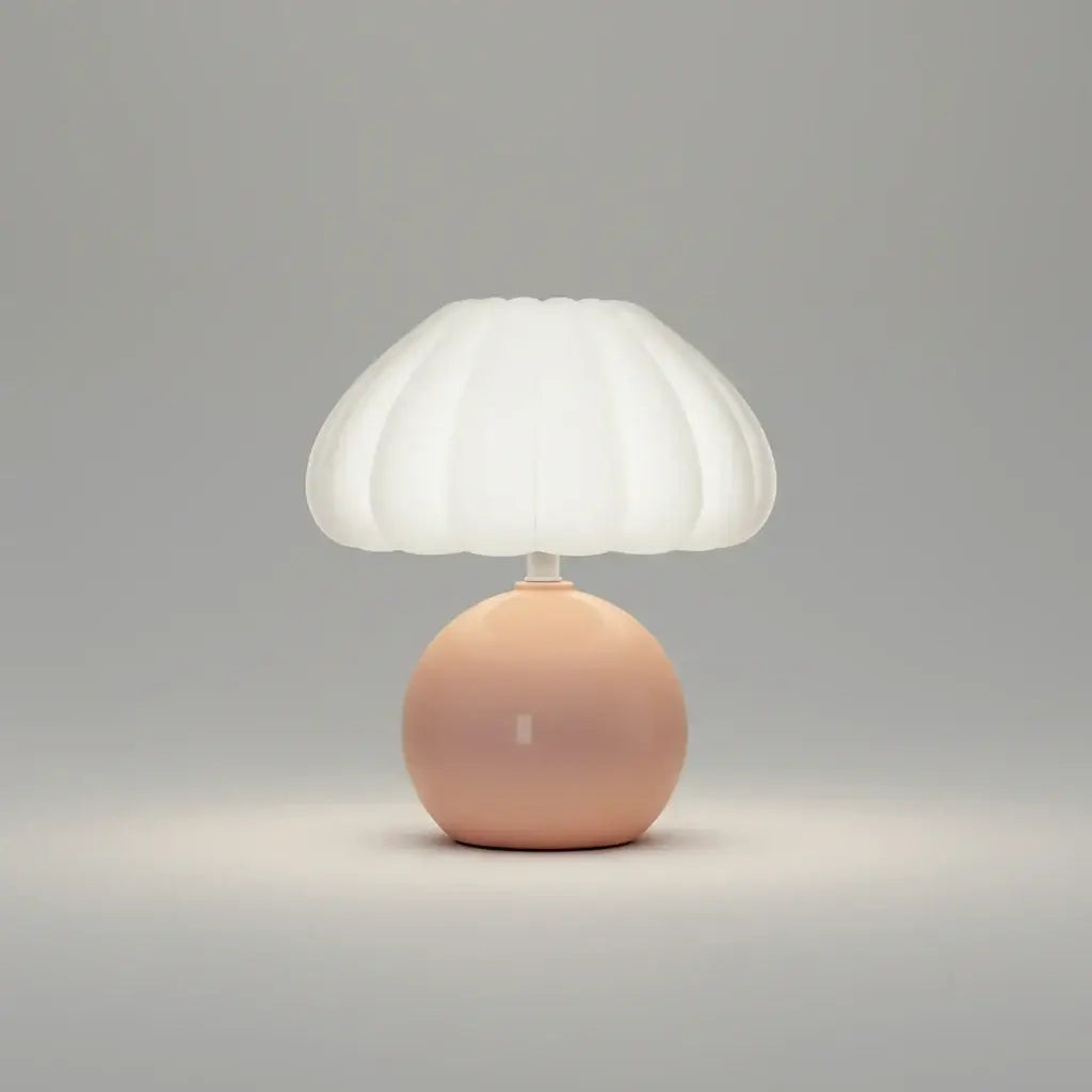 Hero Table lamp with a white shade and pink base on a grey background.