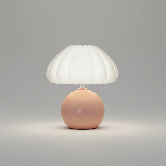 Hero Table lamp with a white shade and pink base on a grey background.