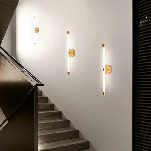 Postmodern Tube Pipe  Wall Light in gold along stairway, showcasing stylish and contemporary lighting.