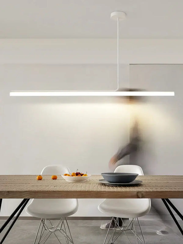 Retro 70s Neon Kitchen Island Pendant in Black or White over a modern dining table with fruit.