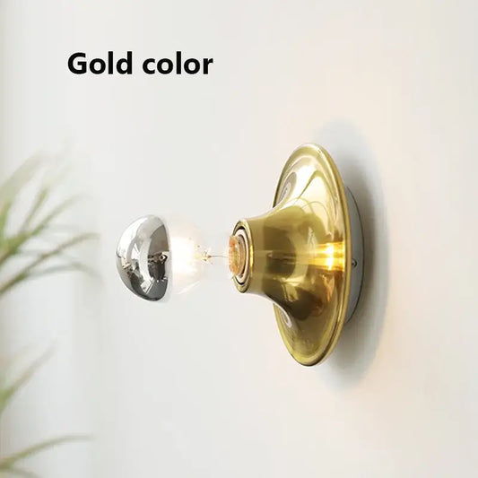 80s revival wall light in gold color showcasing stylish UFO shape and vibrant design.