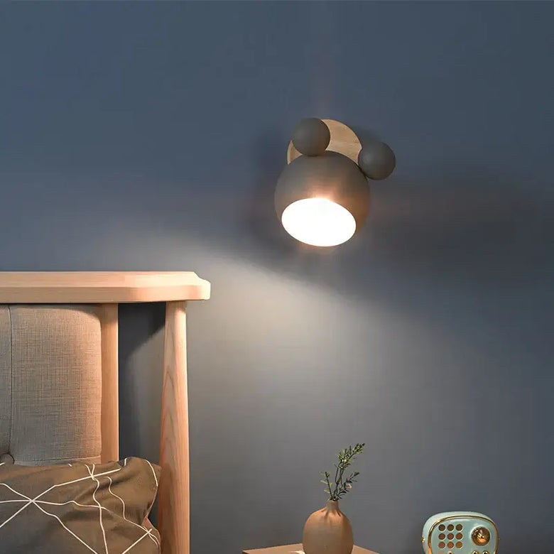 Mouse-shaped Wall Lamps illuminating a cozy bedroom with playful design and energy-efficient LED light.