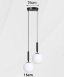 Modern Gold Glass Ball Pendant featuring two white glass balls with adjustable height and black metal fixtures.