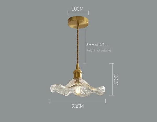 Elegant Glass Pendant Light with Brass Accents - Illuminate with Style, featuring a wavy glass design and brass holder.
