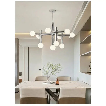 Bauhaus Chrome Chandelier – Modern 10/13 Globe Pendant Light illuminating a contemporary dining area with a sleek design.