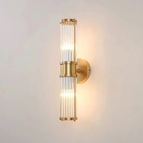 Unique Collection of Art Deco Sconces featuring elegant gold and crystal design, perfect for modern bathrooms and interiors.