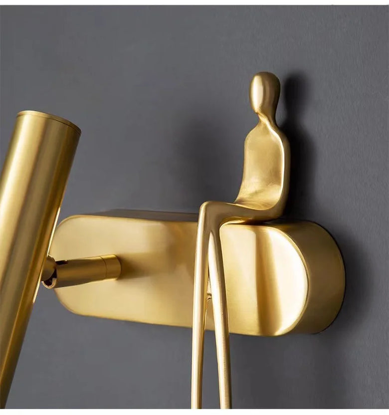 Minimalist Wall mounted Light with Seated human figure, Gold/Black