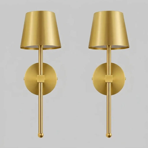 Hero Two gold wall sconces on a grey background.