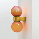 Chic Dual Bubble Wall Light - Modern & Versatile Lighting featuring polished brass and vibrant colored balls