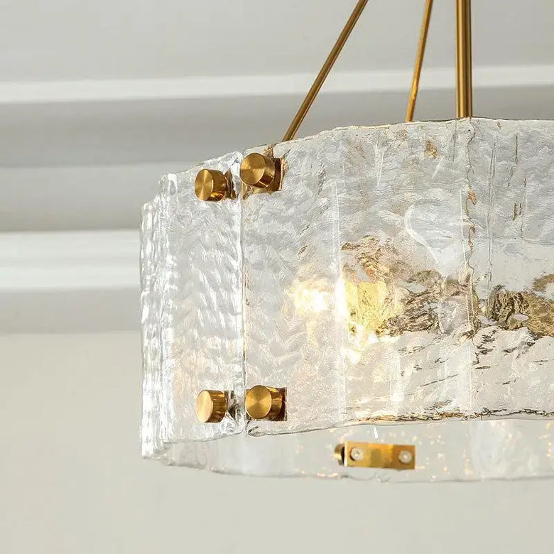 Textured Glass Crystal Pendant Light with Gold Frame showcasing elegant texture and warm illumination.