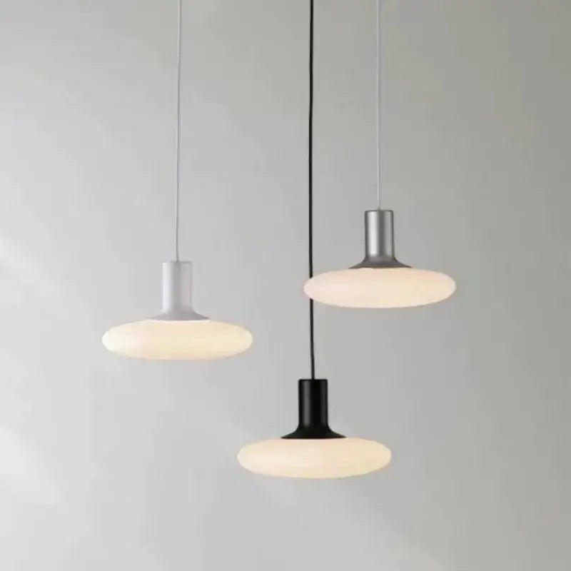 Nordic UFO LED Pendant Light – Minimalist Floating Disc Ceiling Lamp in black, gray, and white finishes.