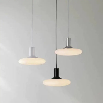 Nordic UFO LED Pendant Light – Minimalist Floating Disc Ceiling Lamp in black, gray, and white finishes.