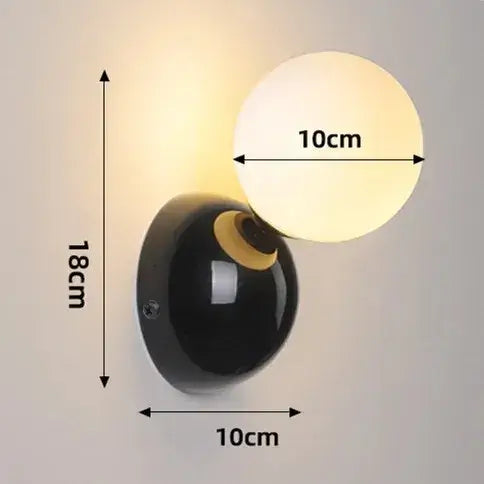 70s revival wall lamp in 3 different colours with a painted metal base and frosted glass ball.