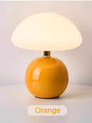 Mushroom LED USB Table Lamp in Pink – Soft Glow Bedside Lighting with orange base and soft white shade.