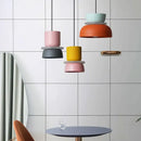 Customizable Modern Pendant Lights in vibrant colors hanging in a modern room setup.