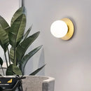 Simple Round Wall Lamp illuminating a modern interior with stylish design and energy-efficient lighting.