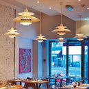 Classic Nordic Designer Pendant Lights Available in 3 different sizes hanging in a modern restaurant setting.