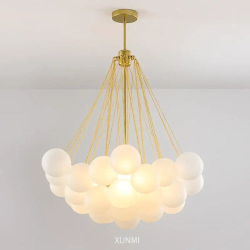 Contemporary Frosted Glass Ball & Gold Chain Chandelier with elegant design and multiple glass balls for opulent illumination.