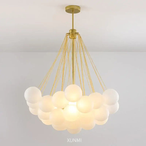 Contemporary Frosted Glass Ball & Gold Chain Chandelier with elegant design and multiple glass balls for opulent illumination.