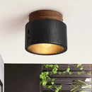 Black Travertine Ceiling Lamp showcasing a modern design with natural stone and a warm glow.