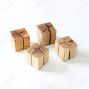 Natural Wood Wall Lights made from solid wood blocks featuring unique grain patterns.