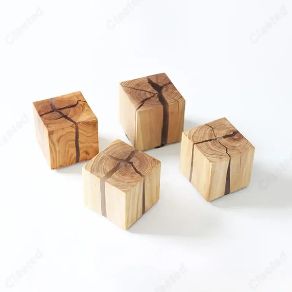 Natural Wood Wall Lights made from solid wood blocks featuring unique grain patterns.