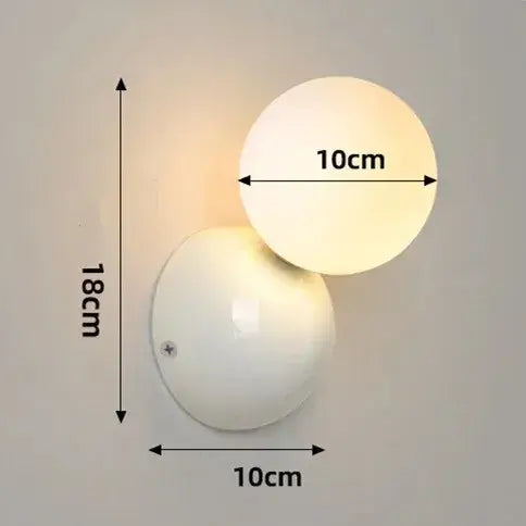 70s revival wall lamp in 3 different colours with frosted glass ball and painted metal base dimensions 10cm x 18cm.