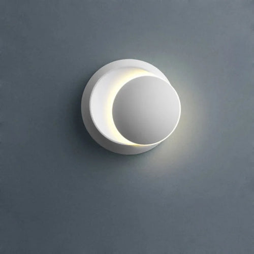 Round wall light fixture on a gray wall