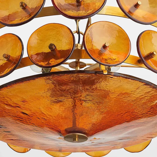 Luxurious Glass Disc Chandelier – 50s Chic featuring amber glass discs and gold accents for elegant lighting.