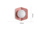 Chic Modern Sconce Collection – Illuminate with Style, featuring a pink hexagonal design with a round light.