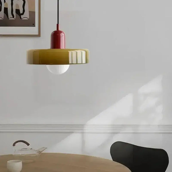 Italian Glass 70s Pendant Lights | Vintage Elegance | Shop Now! hanging lamp in warm colors above a dining table.