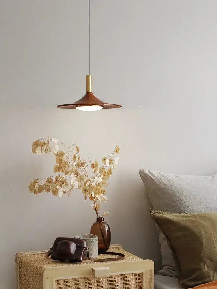 Walnut Mid Century Modern Chandelier illuminating a cozy interior with decorative vase and neutral decor.