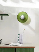 Retro Glass Disc Ceiling Light – Colourful Nordic Flush Mount Fixture for Hallways and Bedrooms in green color on wall.