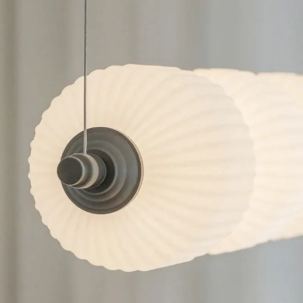 Nordic Art Deco Linear LED Pendant Light – Sculptural Acrylic & Iron Chandelier close-up of acrylic shade detail.