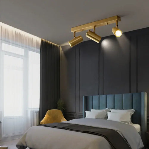 Gold Nordic Minimalist LED Spotlight Ceiling Light illuminating a modern bedroom.
