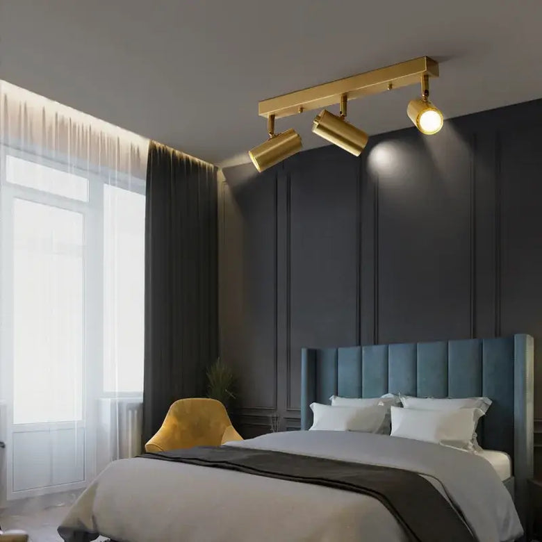 Gold Nordic Minimalist LED Spotlight Ceiling Light illuminating a modern bedroom.