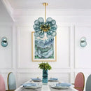 Glorious Tinted Glass Bubble Chandelier illuminating a modern dining room with a stylish design.