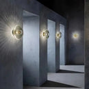Radiant Modern Glass Wall Lamp illuminating a stylish interior corridor with captivating light patterns.