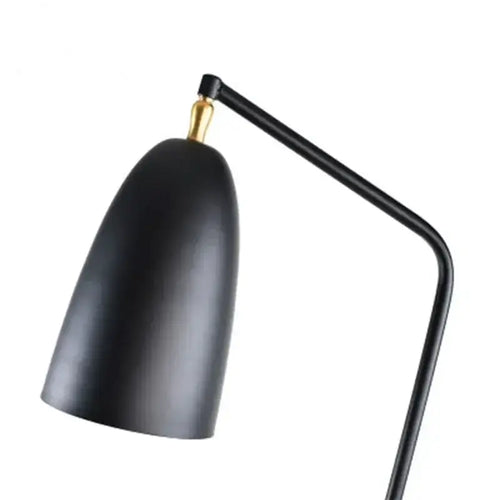 Danish Designer Grasshopper Floor Lamps featuring a sleek black shade and gold accent.