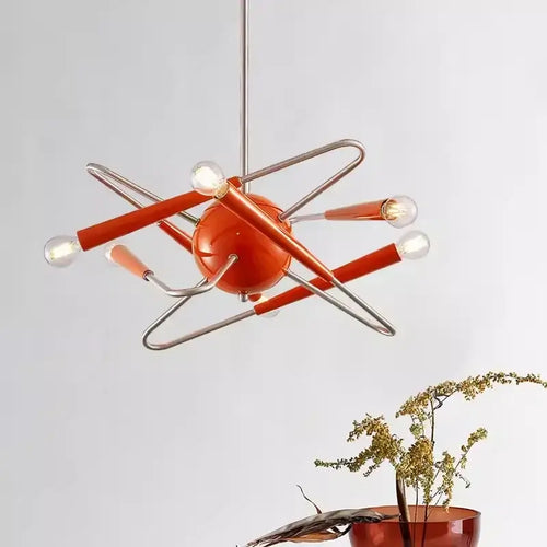 60s Red Sputnik Chandelier in bold red-orange finish hanging in a modern interior setting.
