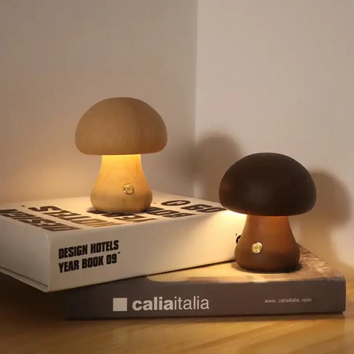 Portable Dimmable 60s Italy Designer Mushroom Table Lamp on books with warm glow.
