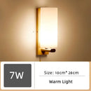 Wood and Frosted Glass Japanese Minimalist Sconces featuring warm light and measuring 10cm by 28cm.