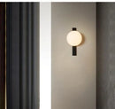 Minimalist Nordic Wall Lamp with Frosted White Ball installed on a stylish wall, showcasing its elegant design.