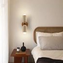 Modern Travertine and Wood Wall Light with Pull Chain – Nordic Style LED Fixture illuminating a cozy bedroom.