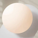 Discover the Vintage Elegance of the 70s-Inspired Metal and Glass Sconce featuring a frosted glass globe.