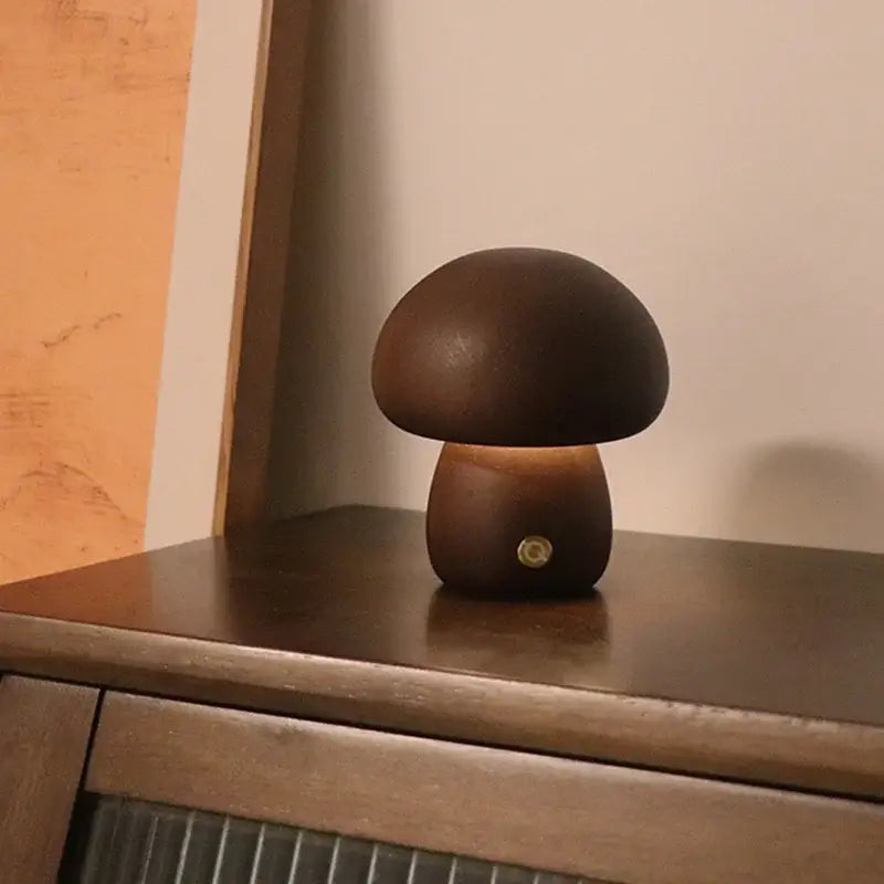 Portable Dimmable 60s Italy Designer Mushroom Table Lamp on a wooden surface, showcasing its warm glow and unique design.