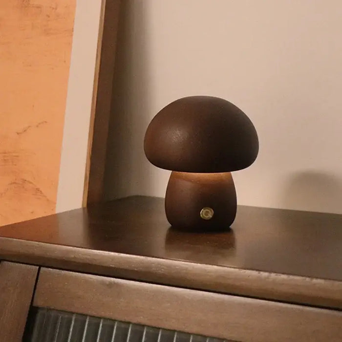 Portable Dimmable 60s Italy Designer Mushroom Table Lamp on a wooden surface, showcasing its warm glow and unique design.
