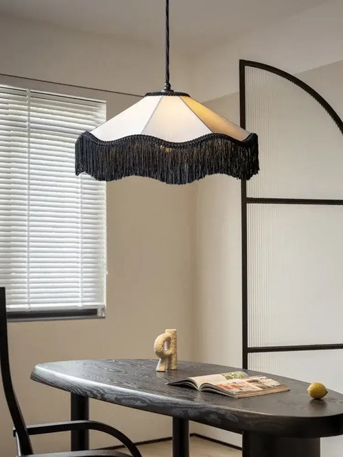 French Retro Fabric Pendant Light – Art Deco Fringe Chandelier for Bedrooms & Lounges illuminating a stylish dining area.
